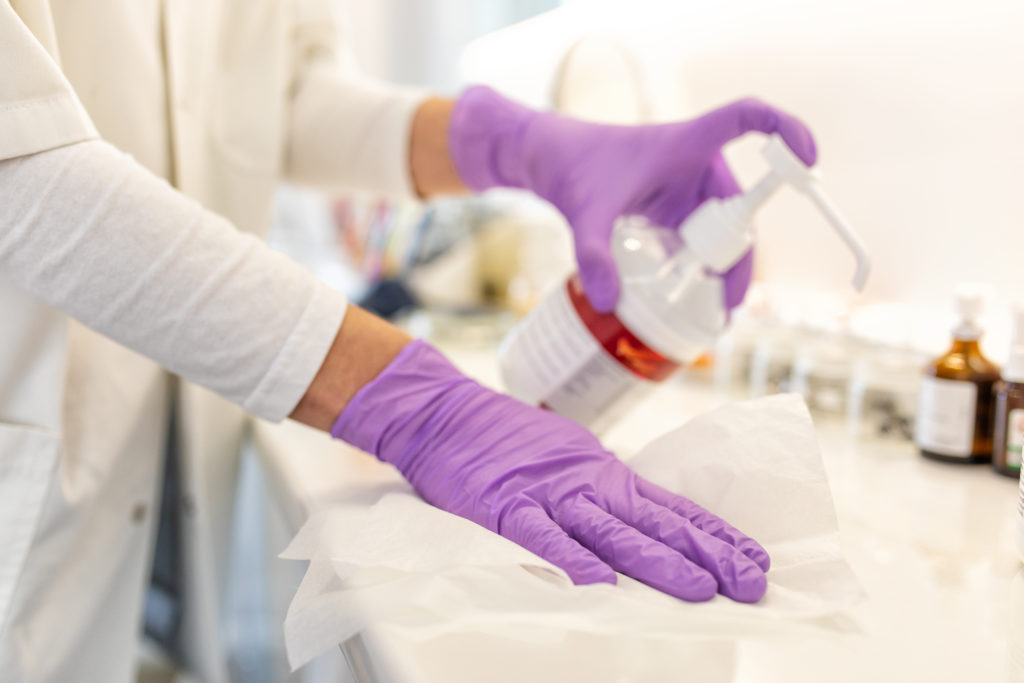 Female doctor cleaning laboratory equipment Eurodent Treat Yourself